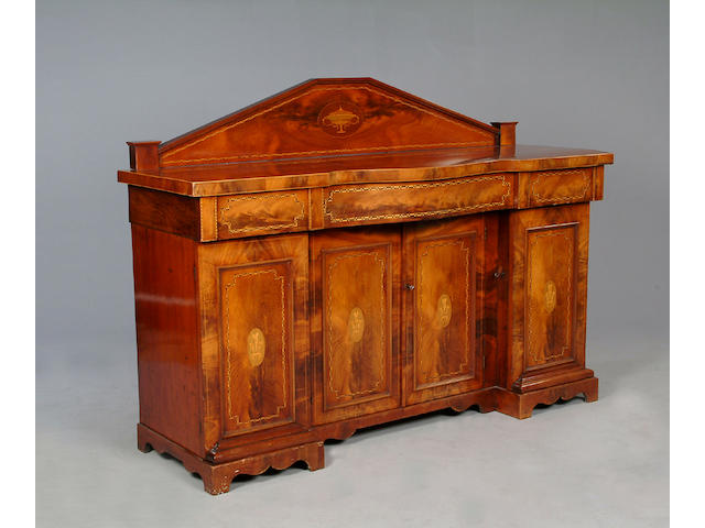 An Edwardian mahogany and marquetry inlaid twin pedestal sideboard