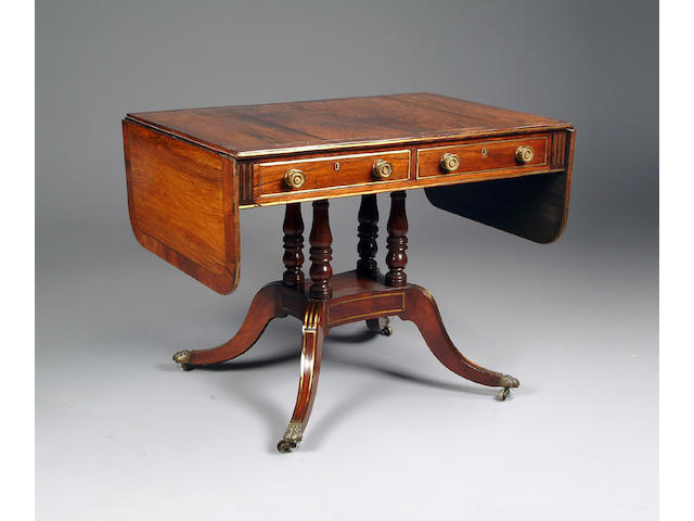 A Regency rosewood and brass strung sofa table