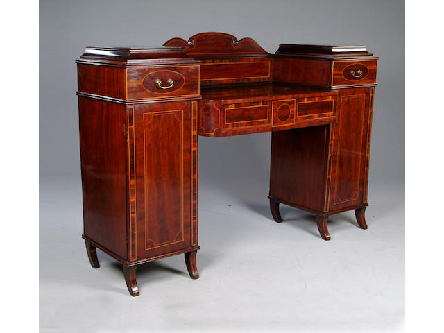 An Edwardian Regency style mahogany twin pedestal sideboard