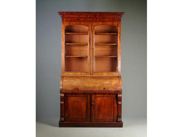 A Victorian mahogany roll top bureau bookcase