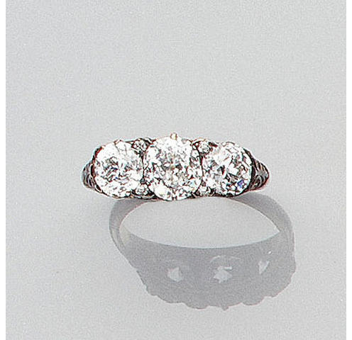 A late Victorian diamond three-stone ring