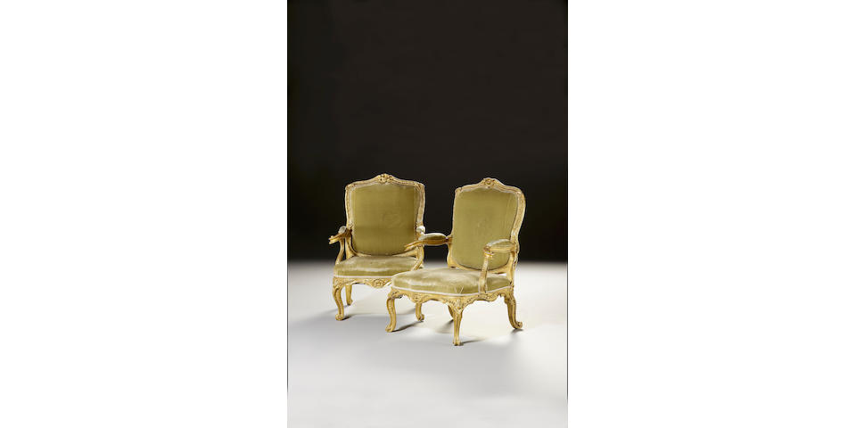A fine pair of George III carved giltwood Open Armchairs,