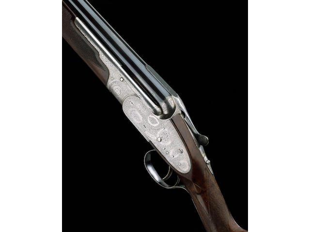 A FINE 12-BORE SINGLE-TRIGGER OVER-AND-UNDER SIDELOCK EJECTOR GUN BY BOSS, NO. 6848 In a leather case