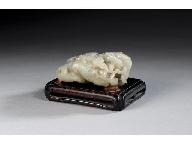 A 'celadon' jade carving of a Buddhistic lion and her young, with wood stand [2]
