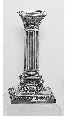 A pair of late Victorian dwarf Corinthian column candlesticks, by Martin and Hall, Sheffield, 1894,