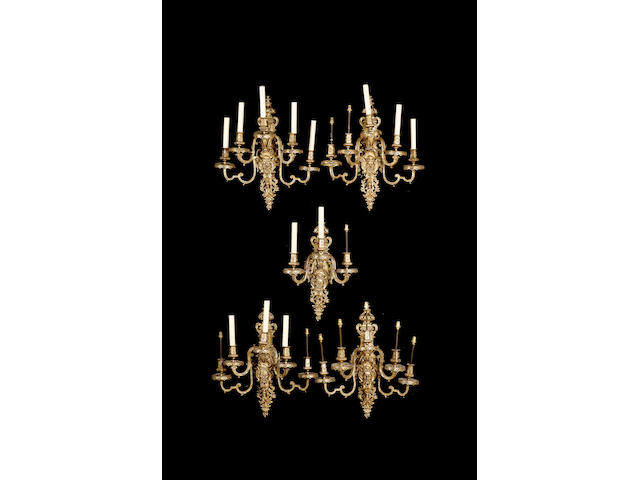 A set of four gilt metal Louis XIV style five branch wall lights