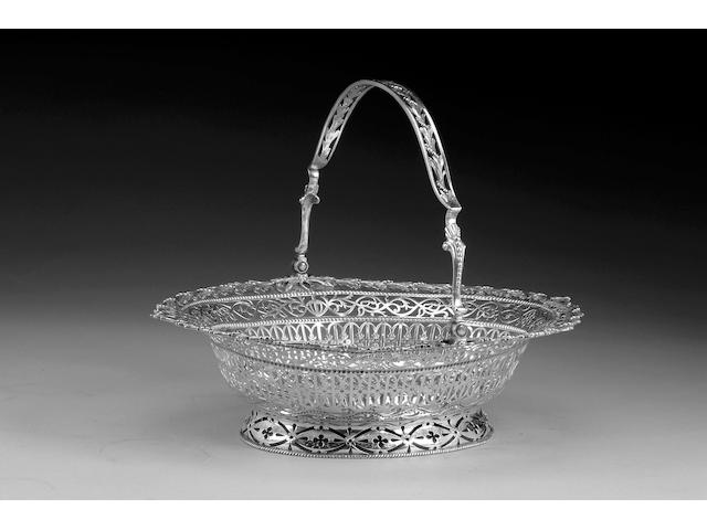 A George III silver oval swing handled basket, possibly by Richard Meach, London 1772,