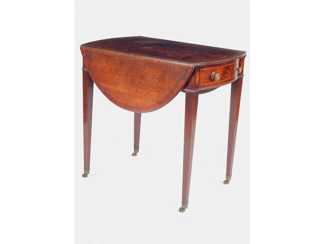 A George III mahogany oval pembroke table