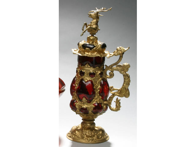 A Bohemian ruby glass and ormolu stein,