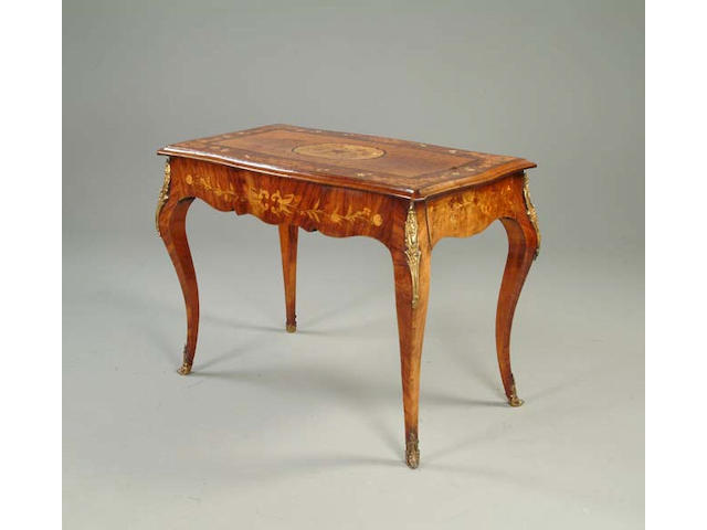 A Louis XV style walnut, marquetry inlaid and gilt metal mounted centre table