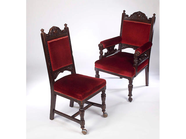 A set of twelve Victorian oak and upholstered dining chairs,