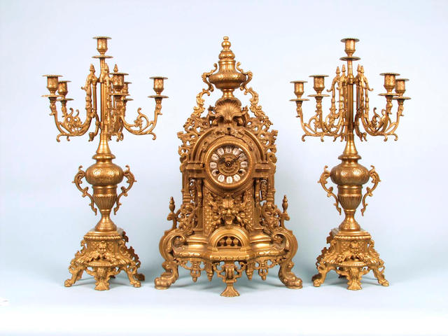 A French brass clock garniture