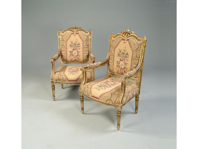 A pair of Regence style gilt carved fauteuils
