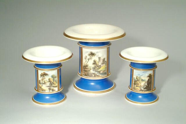 A garniture of three Rockingham spill vases