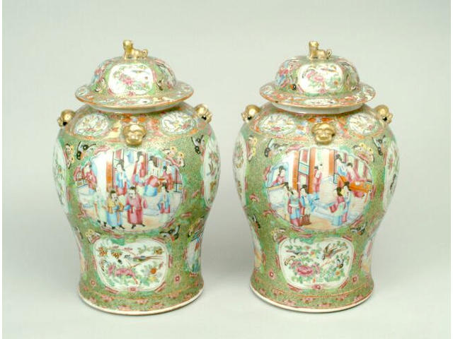 A pair of Canton Famille Rose vases and covers