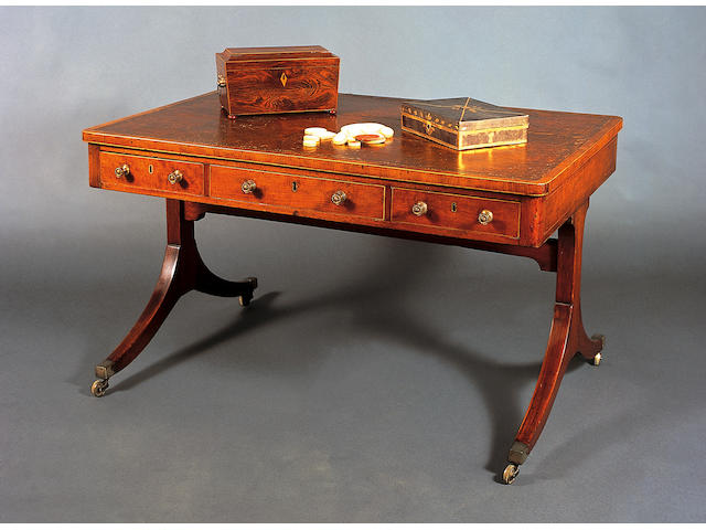 An early 19th Century kingwood and boxwood line edged tea caddy of sarcophagus form,