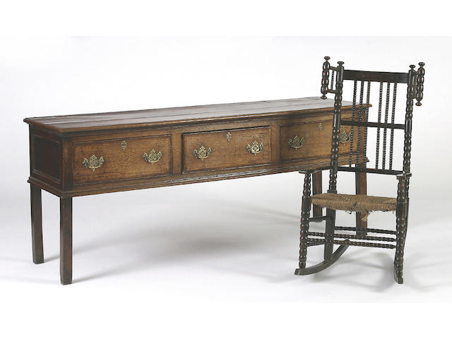 A late 18th Century oak low dresser,