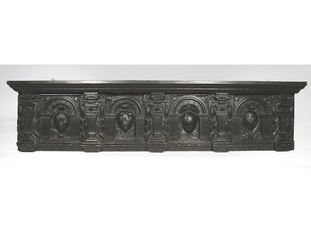 Four 17th Century carved oak armorial panels,