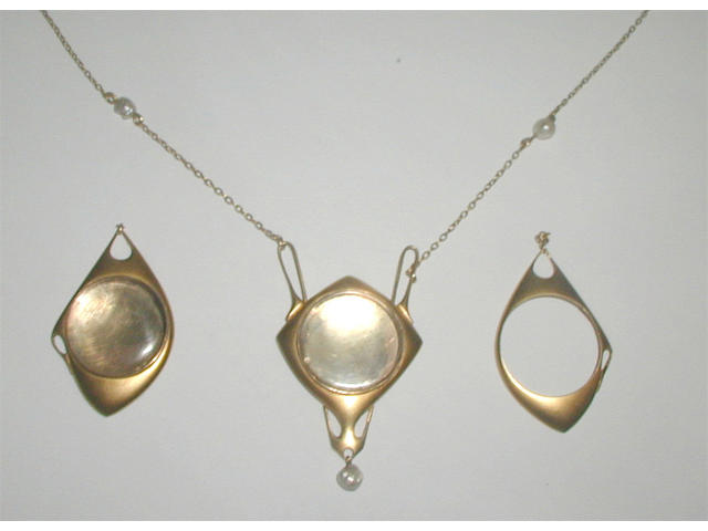 A gold and seed pearl pendant, probably by Archibald Knox, retailed by Liberty & Co.,