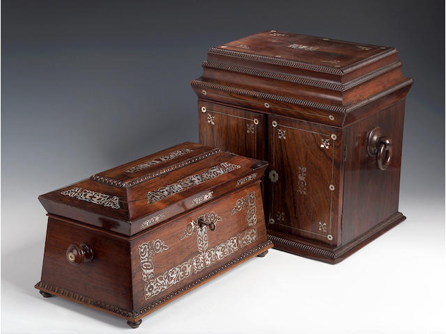 A Victorian rosewood and mother of pearl inlaid sarcophagus shaped Tea Caddy,