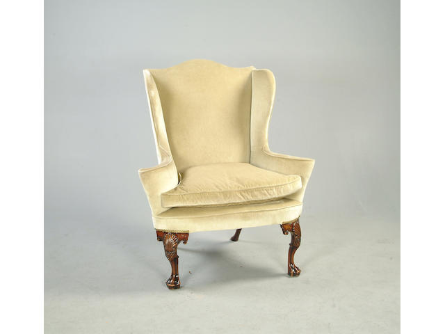 A Queen Anne style walnut framed wing back armchair