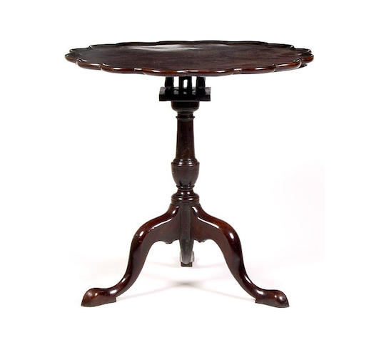 A George III mahogany pie crust wine table