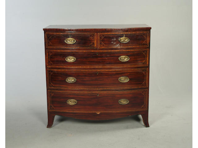 A George IV mahogany and tulipwood banded bow front chest