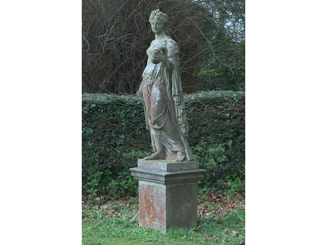 A composition stone figure of a classical woman,