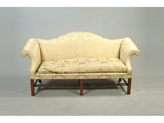 A pair of George III style mahogany sofas
