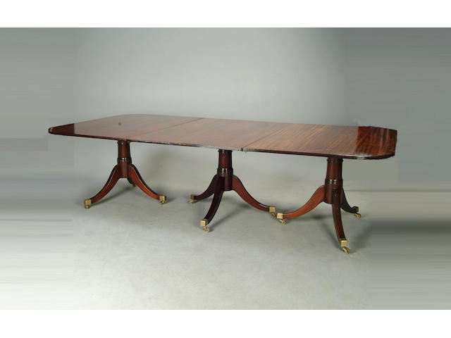 A Regency style mahogany four pedestal dining table
