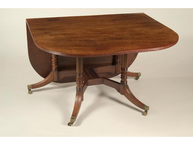 A good George III drop flap dining table,