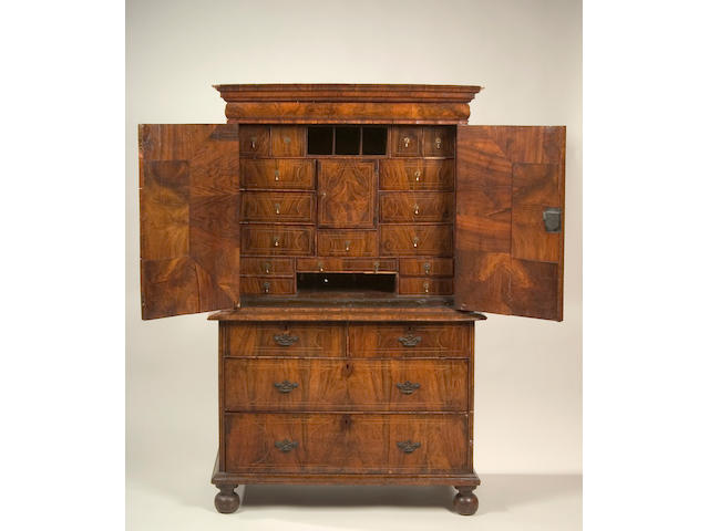 A William and Mary walnut, boxwood and ebony strung cabinet on chest,
