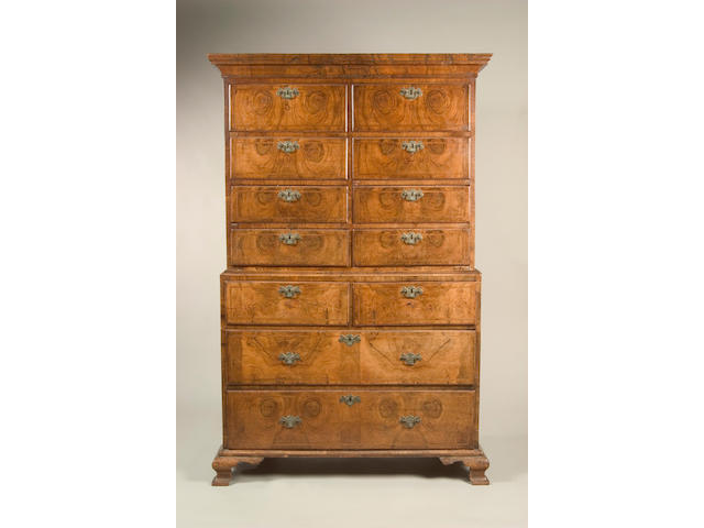 A George I walnut and feather banded tallboy chest,