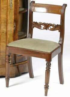 A set of six early 19th Century mahogany dining chairs,