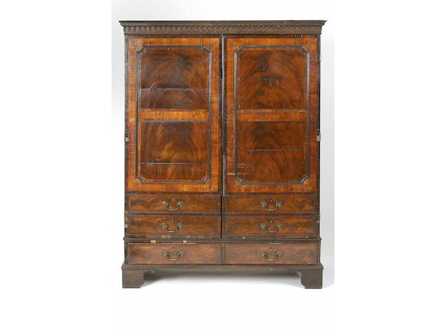 A George III mahogany and satinwood linen press,