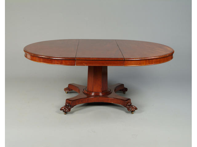 A Victorian mahogany extending circular dining table