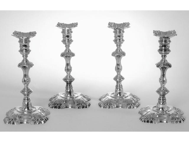 A matched set of four George II cast candlesticks, by William Gould, London 1748 (2) and 1749 (2),