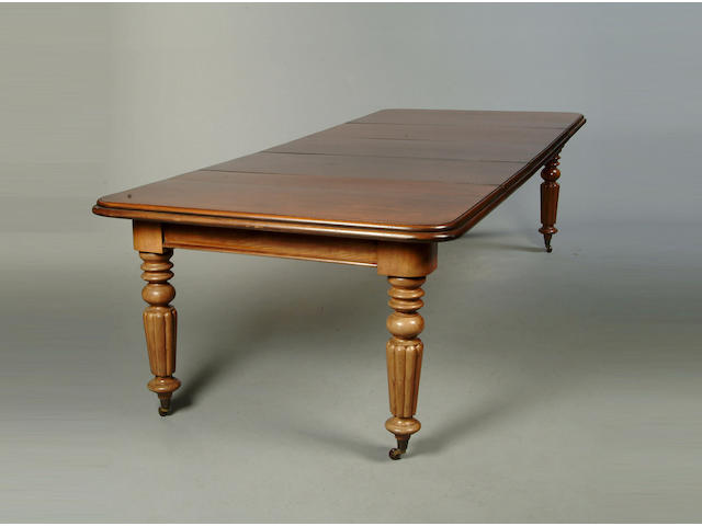 A Victorian mahogany extending dining table