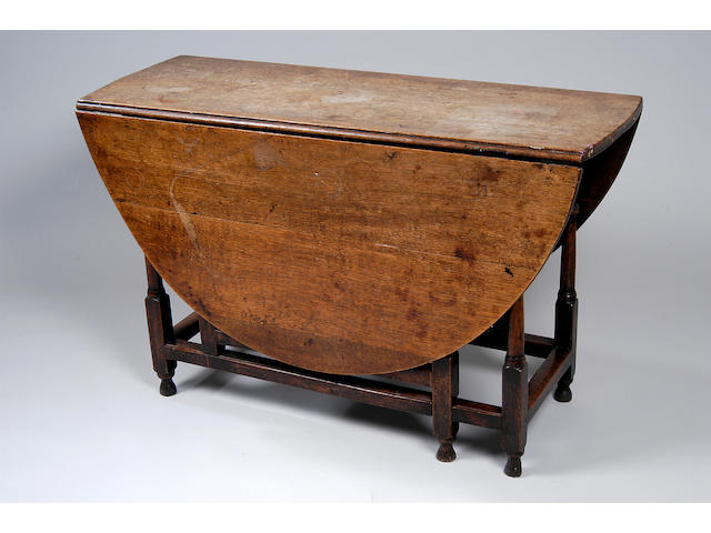 An 18th Century oak gate-leg table,