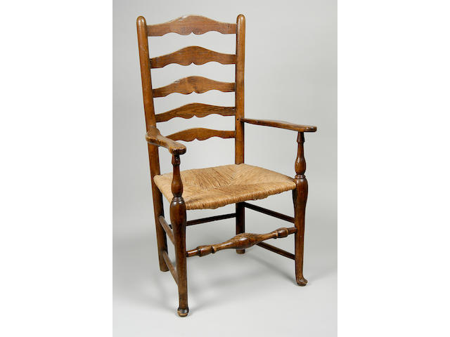 A George III ash ladder back elbow chair,