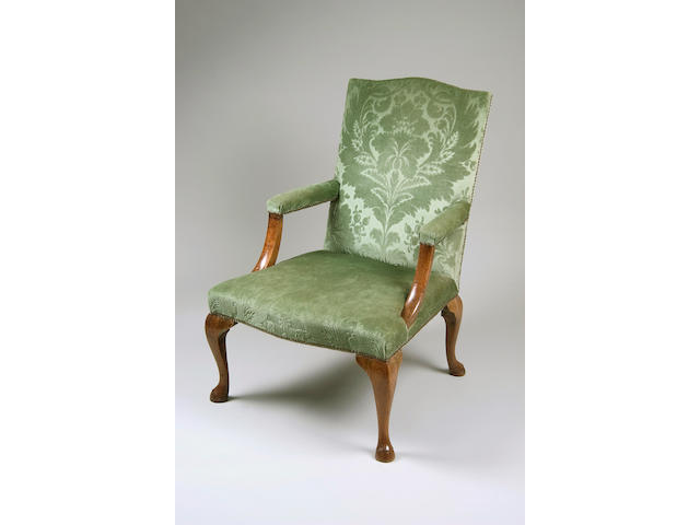 A George III provincial fruitwood Gainsborough type elbow chair,