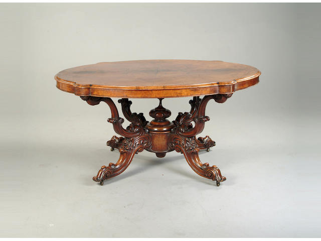 A Victorian walnut breakfast table