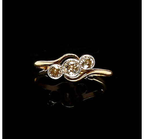 A diamond three stone crossover ring