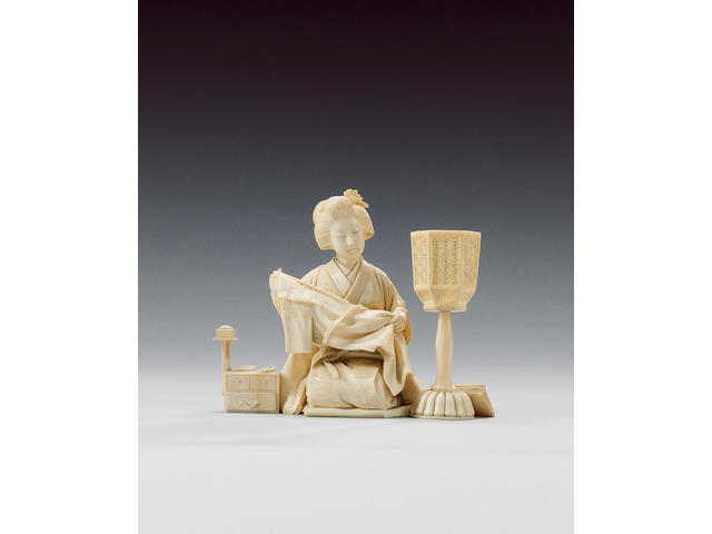 An elegant ivory okimono of a kneeling Yamato Nadeshko,