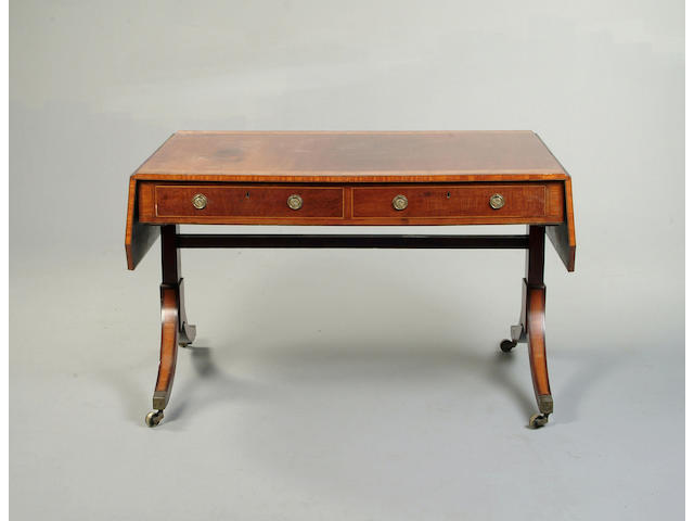 A Regency mahogany, satinwood and amboyna crossbanded sofa table
