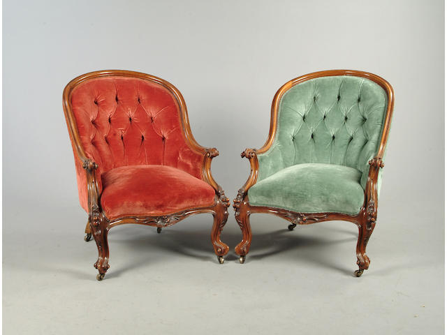 A pair of Victorian walnut armchairs
