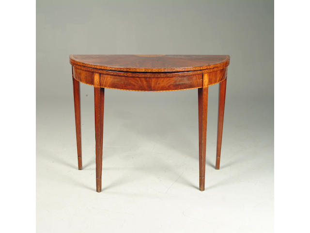 A George III mahogany and marquetry demi lune card table
