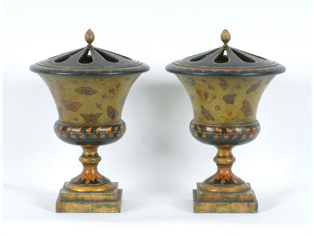 A pair of Regency pot pourri urns with pierced covers