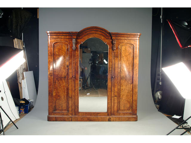 A Victorian walnut three section wardrobe
