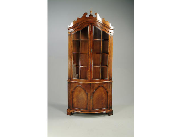 An 18th century style walnut corner display cabinet